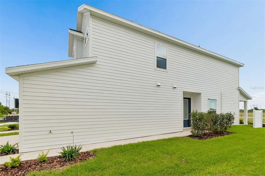 Exterior details and patio area of a home in Waterset Townhomes, Apollo Beach (Image 3).