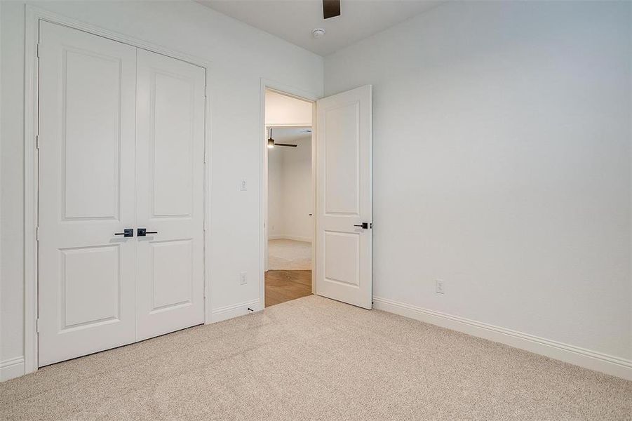 Secondary bedroom with ceiling fan