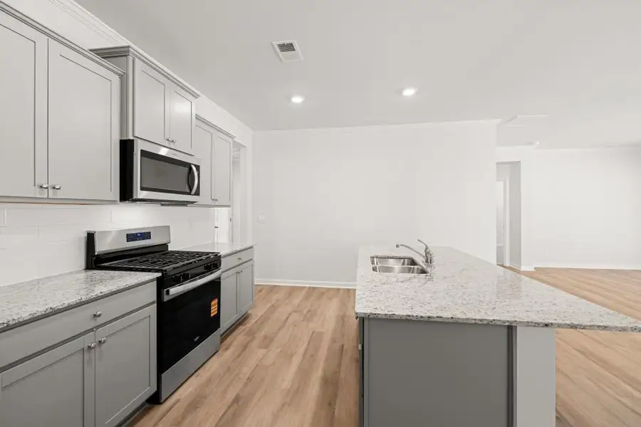 Furnished interior view inside a new home in Northwoods at Mirror Lake, Villa Rica (Image 7).
