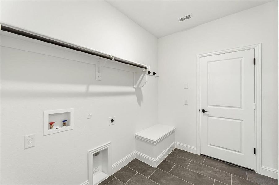 Laundry-Utility Room also has a Mud Bench for hooks for jackets & backpacks.  Located with garage access.
