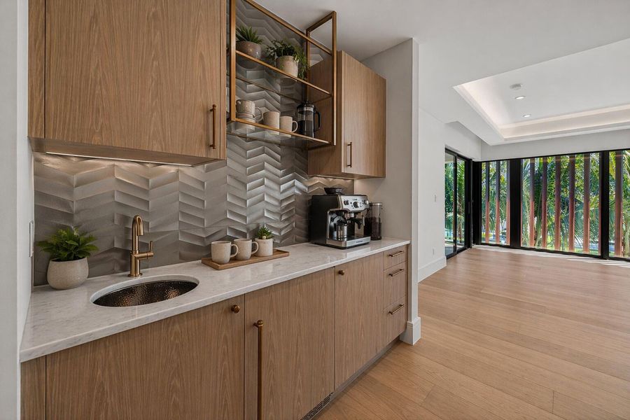 Sleek wet bar with tropical views