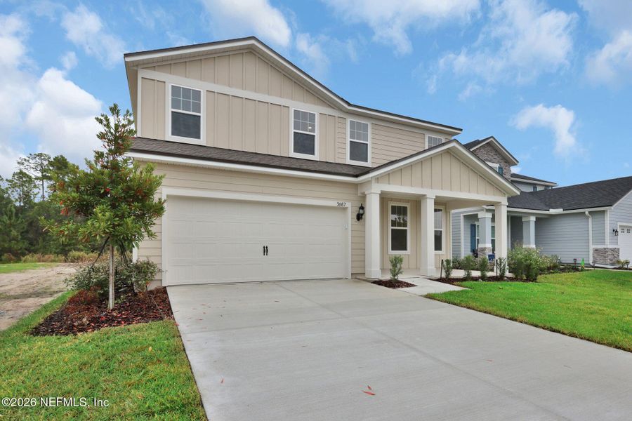 Front exterior of a new home in Hyland Trail, Green Cove Springs, FL, highlighting curb appeal (Image 24).