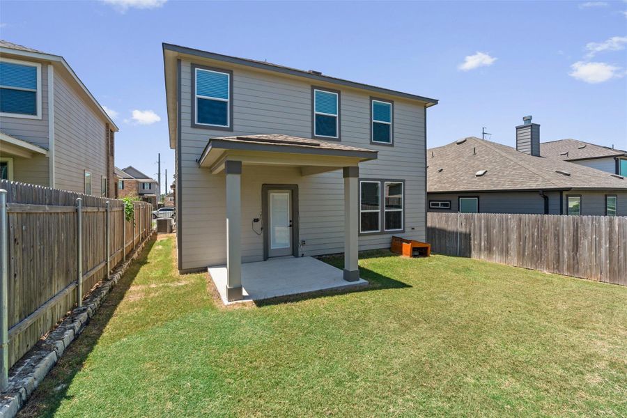 Exterior details and patio area of a home in , Manor (Image 3).