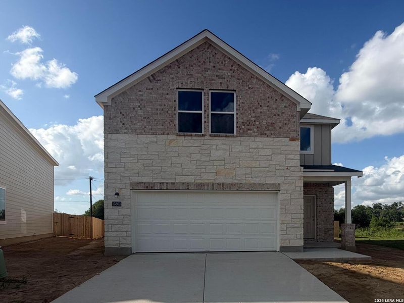 Front exterior of a new home in Hennersby Hollow, San Antonio, TX, highlighting curb appeal (Image 1). Front exterior of a new home in Hennersby Hollow, San Antonio, TX, highlighting curb appeal (Image 1).