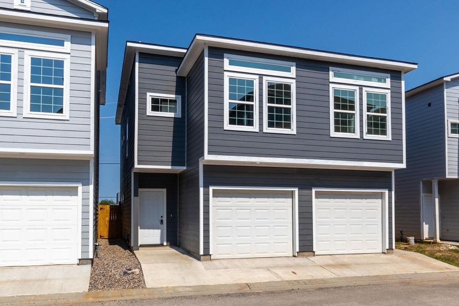 Front exterior of a new home in , Spring, TX, highlighting curb appeal (Image 2). Front exterior of a new home in , Spring, TX, highlighting curb appeal (Image 2).