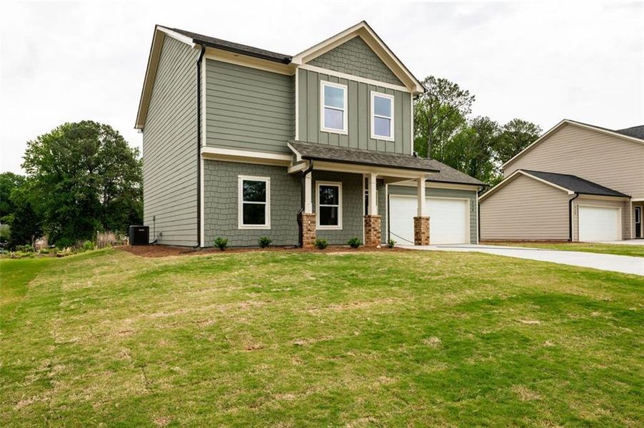 Front exterior of a new home in , Lawrenceville, GA, highlighting curb appeal (Image 13).