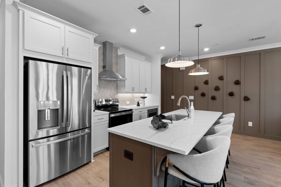 Representative furnished interior of a home built from the The Oleander by The Providence Group in Market Square at Sawnee Village, Cumming (Image 9).