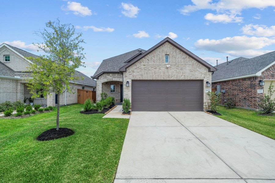 Front exterior of a new home in Marvida, Cypress, TX, highlighting curb appeal (Image 21). Front exterior of a new home in Marvida, Cypress, TX, highlighting curb appeal (Image 21).