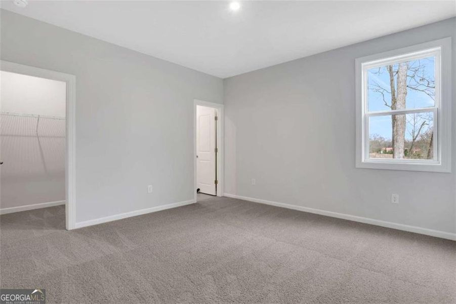 Spacious, unfurnished interior of a new home in The Paddocks at Doc Hughes, Buford (Image 57).