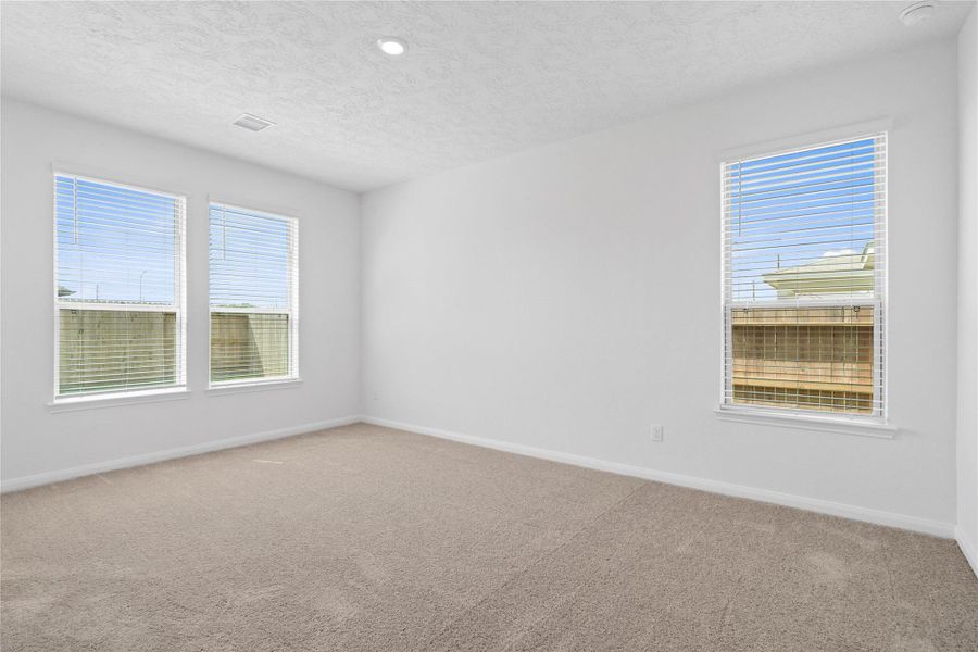 What a wonderful place to come home to! This stunning primary suite greets you with plush carpet floors, neutral paint, recessed lighting, large windows with blinds allowing in natural light brightening up this spacious bedroom. What a wonderful place to come home to! This stunning primary suite greets you with plush carpet floors, neutral paint, recessed lighting, large windows with blinds allowing in natural light brightening up this spacious bedroom.