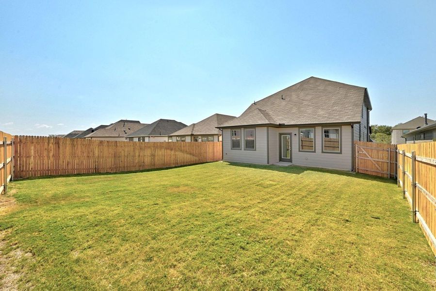 Exterior details and patio area of a home in Trinity Ranch, Elgin (Image 3). Exterior details and patio area of a home in Trinity Ranch, Elgin (Image 3).