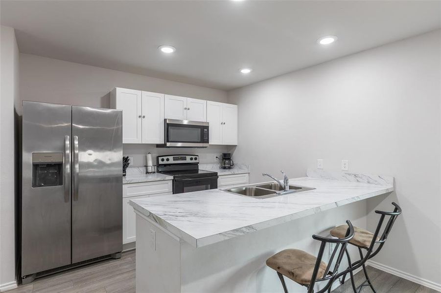 Furnished interior view inside a new home in Waterside at Cedar Creek, Abilene (Image 15).