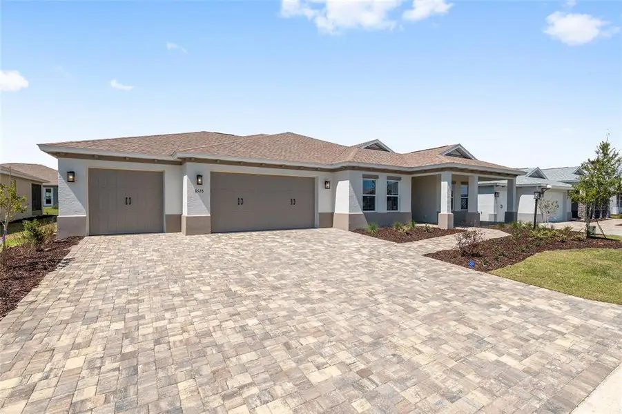 Front exterior of a new home in , Ocala, FL, highlighting curb appeal (Image 26).