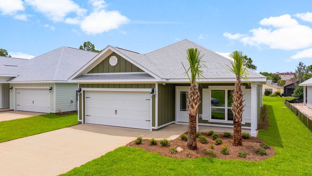 Front exterior of a new home in Caballeros Estates At Hombre, Panama City Beach, FL, highlighting curb appeal (Image 2). Front exterior of a new home in Caballeros Estates At Hombre, Panama City Beach, FL, highlighting curb appeal (Image 2).