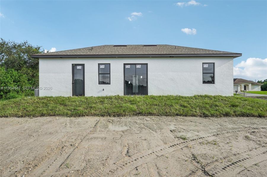 Exterior details and patio area of a home in , Lehigh Acres (Image 4).