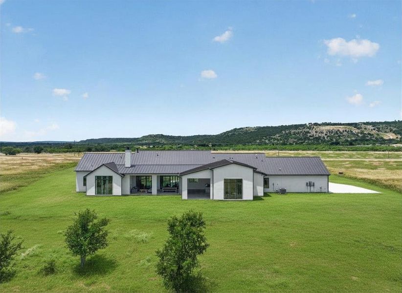 Front exterior of a new home in , Strawn, TX, highlighting curb appeal (Image 21).