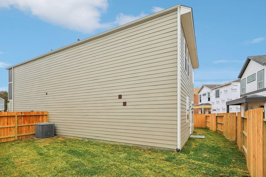 Exterior details and patio area of a home in Pinewood Trails - City Series, Atascocita (Image 3).