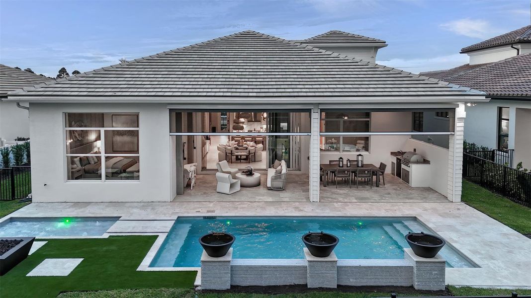 Exterior details and patio area of a home in L'Ambiance at Avenir, Palm Beach Gardens (Image 26).