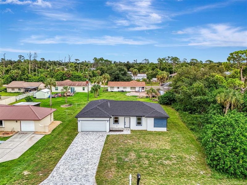 Front exterior of a new home in , Port Charlotte, FL, highlighting curb appeal (Image 2).
