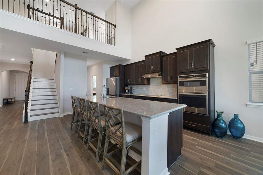 Luxury Vinyl Floors go up the stairs along with White Risers