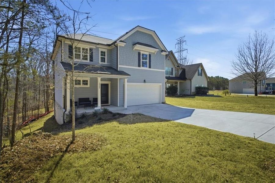 Front exterior of a new home in Tell River, Atlanta, GA, highlighting curb appeal (Image 25). Front exterior of a new home in Tell River, Atlanta, GA, highlighting curb appeal (Image 25).