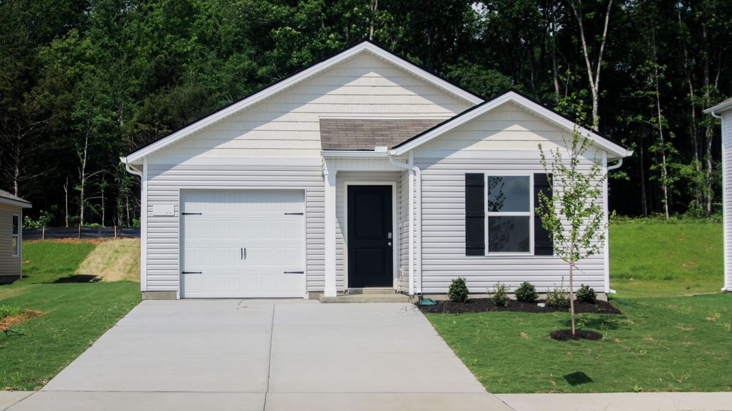 Front exterior of a new home in Parkside Point, Portland, TN, highlighting curb appeal (Image 1).