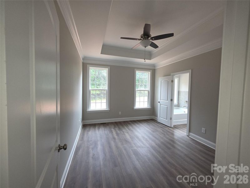 Primary Bedroom with Tray Ceiling Primary Bedroom with Tray Ceiling
