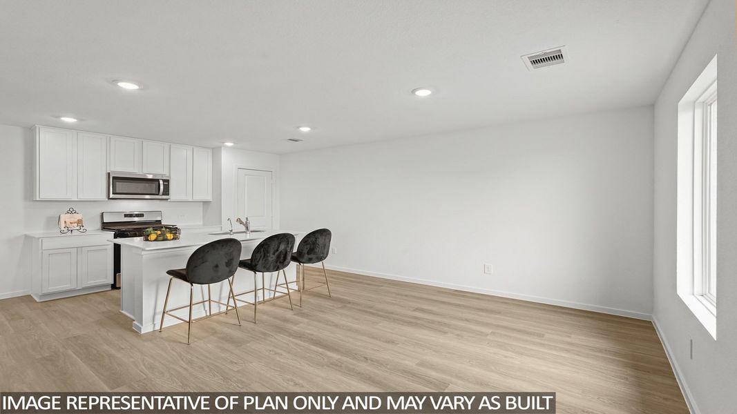 Furnished interior view inside a new home in Sunterra, Katy (Image 5).