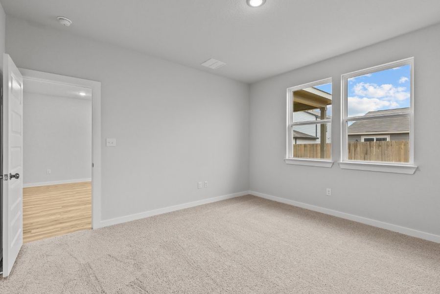 A room with a window and a door.