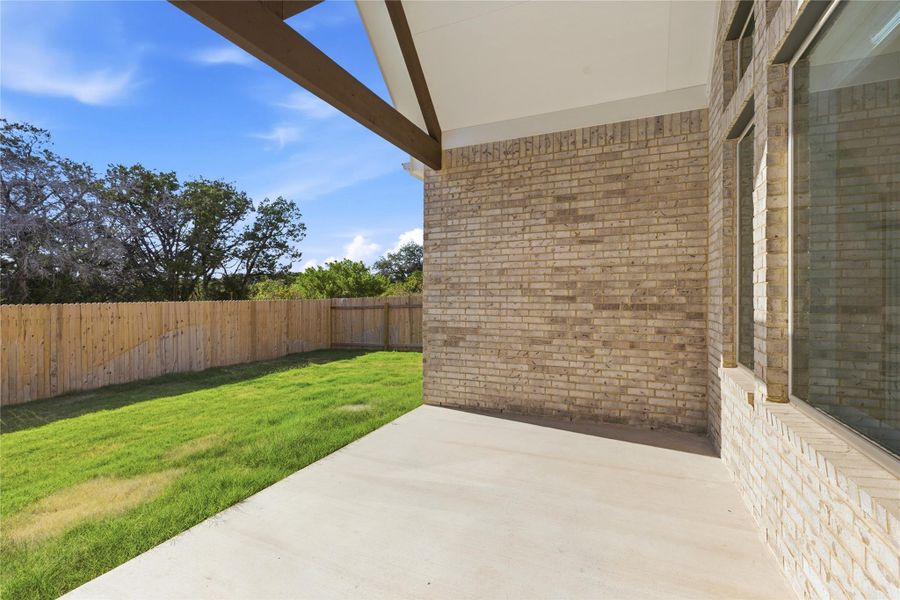 Exterior details and patio area of a home in Retreat at San Gabriel, Georgetown (Image 3).