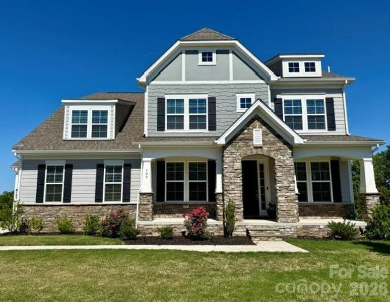 Front exterior of a new home in Legacy at Reid's Cove, Mooresville, NC, highlighting curb appeal (Image 1). Front exterior of a new home in Legacy at Reid's Cove, Mooresville, NC, highlighting curb appeal (Image 1).