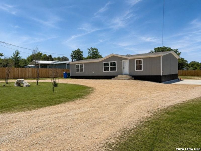 Exterior details and patio area of a home in , Elmendorf (Image 19).