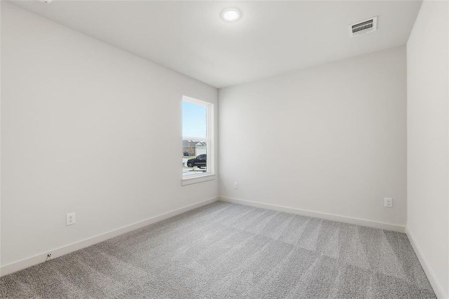 Unfurnished room featuring carpet floors and baseboards Unfurnished room featuring carpet floors and baseboards