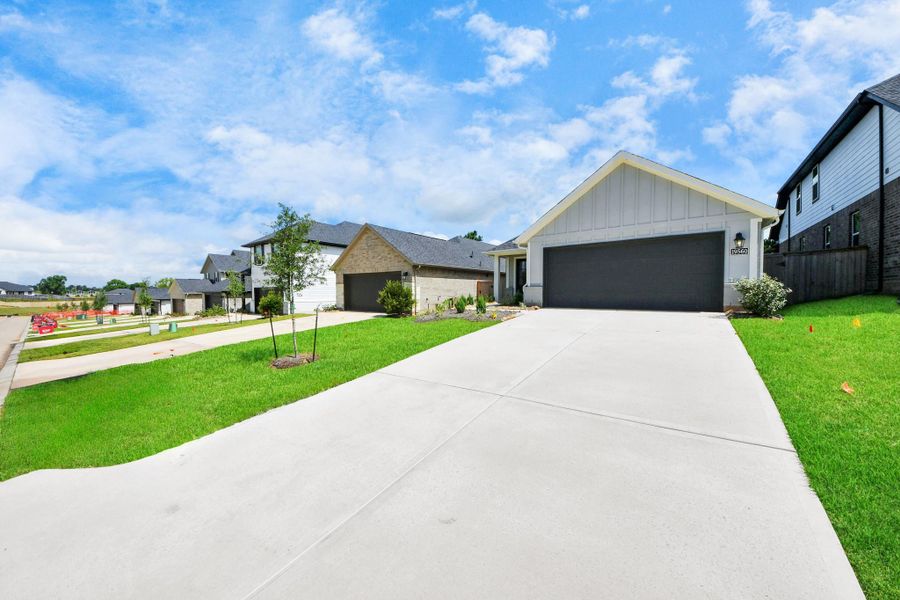Front exterior of a new home in Montgomery Ridge: Landmark Collection, Montgomery, TX, highlighting curb appeal (Image 25). Front exterior of a new home in Montgomery Ridge: Landmark Collection, Montgomery, TX, highlighting curb appeal (Image 25).