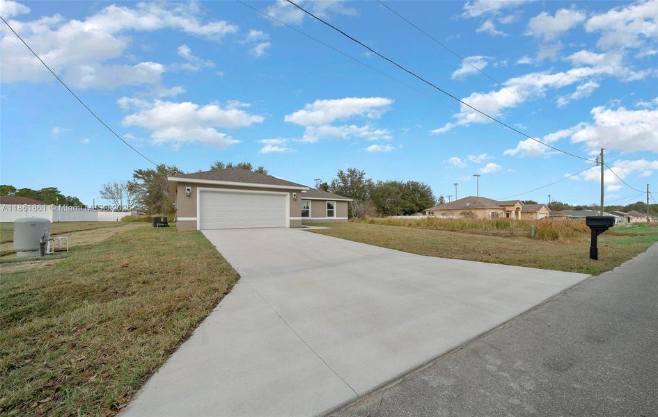 Front exterior of a new home in , Ocala, FL, highlighting curb appeal (Image 17).