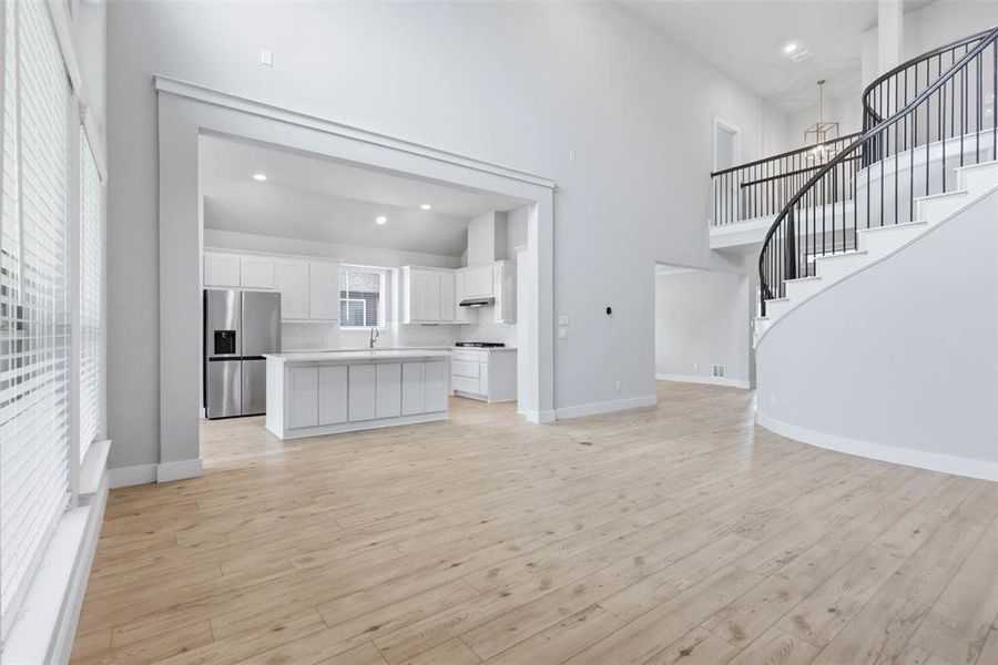 Open living area with seamless flow into the kitchen and dining spaces.