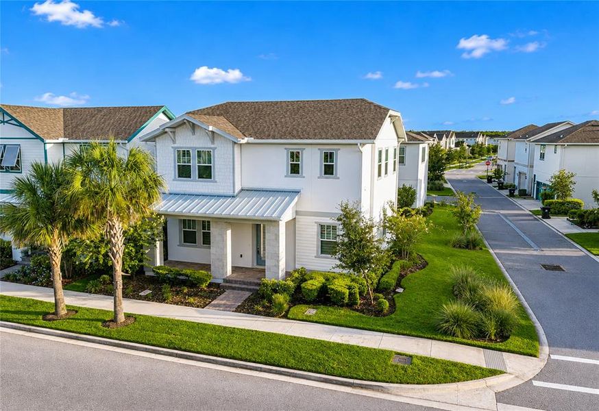 Front exterior of a new home in , Orlando, FL, highlighting curb appeal (Image 27).