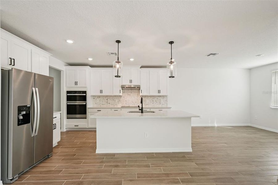 Furnished interior view inside a new home in Oakfield Trails - Signature Series, Parrish (Image 7).