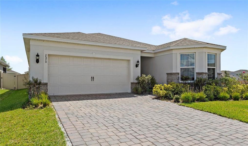 Front exterior of a new home in , Kissimmee, FL, highlighting curb appeal (Image 21). Front exterior of a new home in , Kissimmee, FL, highlighting curb appeal (Image 21).