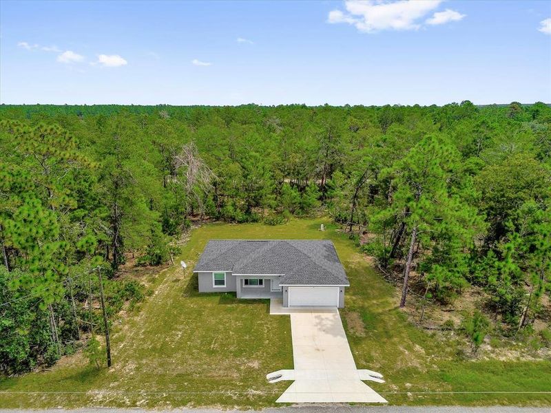 Front exterior of a new home in , Ocklawaha, FL, highlighting curb appeal (Image 17). Front exterior of a new home in , Ocklawaha, FL, highlighting curb appeal (Image 17).