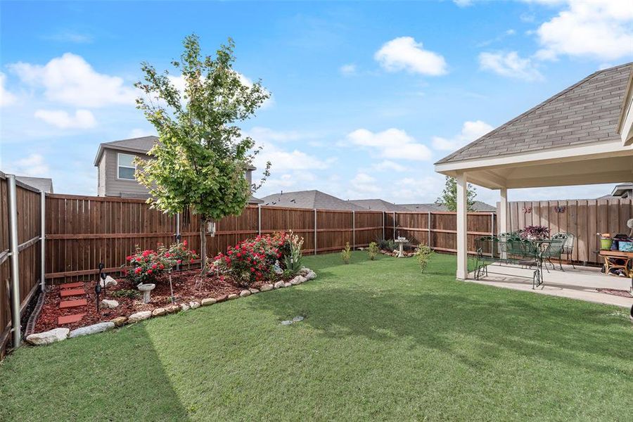 Exterior details and patio area of a home in Walden Pond, Forney (Image 22).