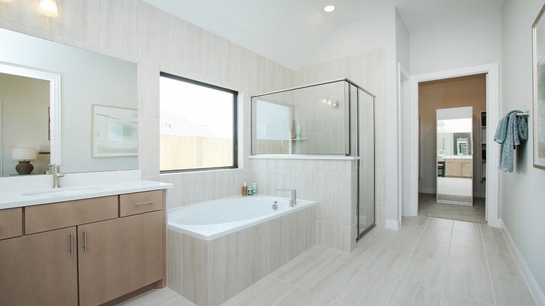 Representative furnished interior of a home built from the Juniper by Brightland Homes in Sunterra, Katy (Image 10).