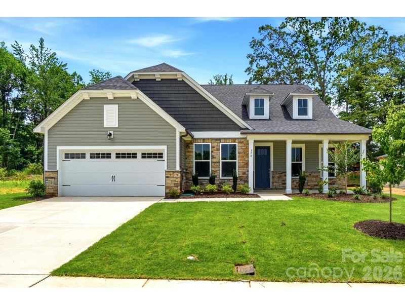 Front exterior of a new home in Windgate, Mooresville, NC, highlighting curb appeal (Image 1). Front exterior of a new home in Windgate, Mooresville, NC, highlighting curb appeal (Image 1).