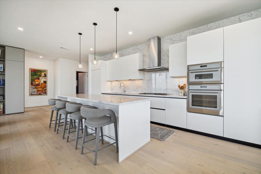 Chef's kitchen has Thermador appliances and Pedini cabinets throughout.