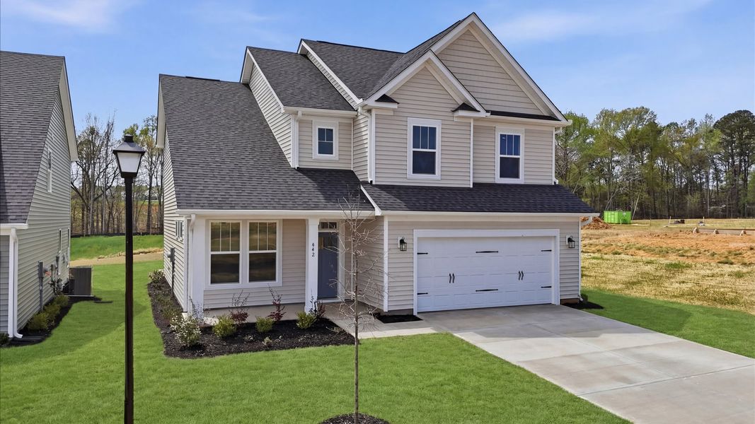 Front exterior of a new home in Harrier Point, Woodruff, SC, highlighting curb appeal (Image 20).