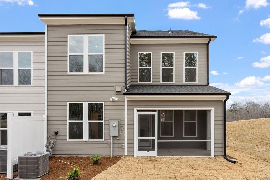 Exterior details and patio area of a home in Ovation at Sweetbrier, Durham (Image 4). Exterior details and patio area of a home in Ovation at Sweetbrier, Durham (Image 4).