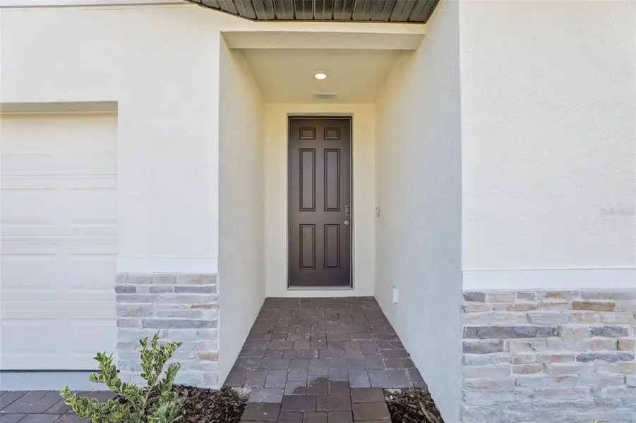 Exterior details and patio area of a home in Lake Deer Estates - Signature Series, Poinciana (Image 4).