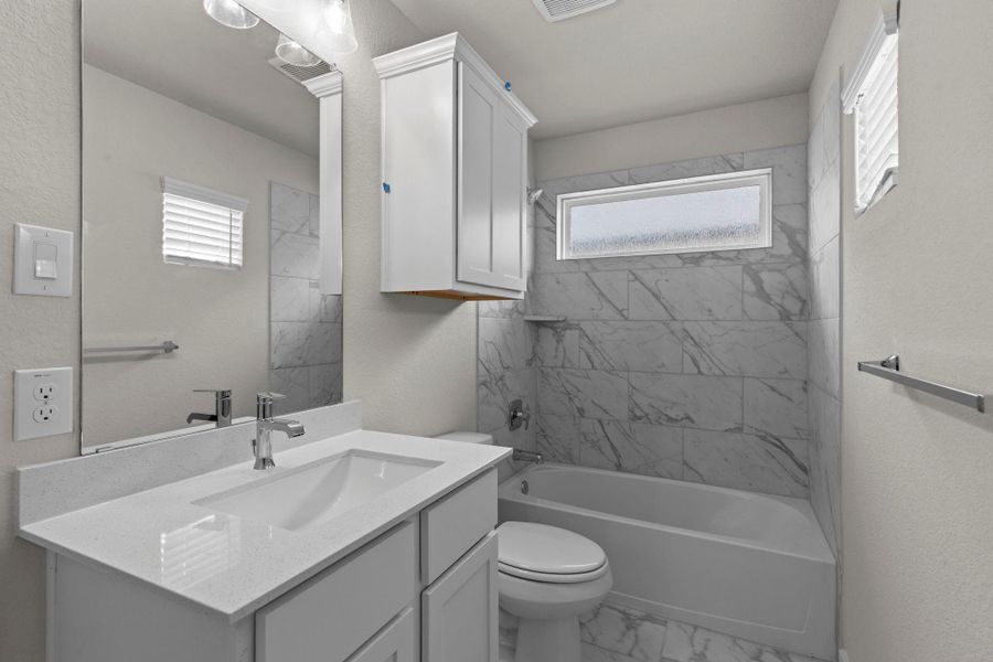 Furnished interior view inside a new home in Barton Creek Ranch, Conroe (Image 7).