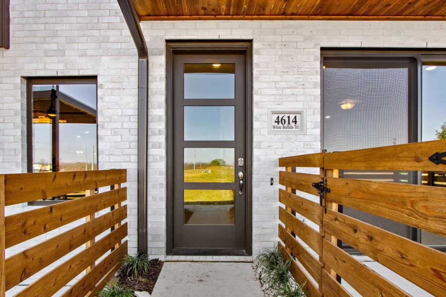 Exterior details and patio area of a home in Wildridge, Oak Point (Image 21).