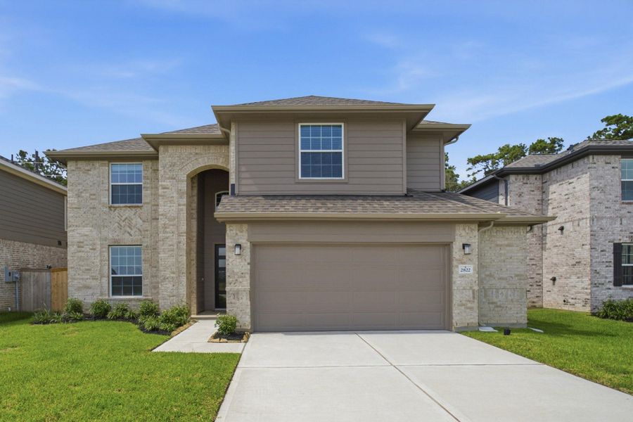 Front exterior of a new home in Sundance Cove, Crosby, TX, highlighting curb appeal (Image 19). Front exterior of a new home in Sundance Cove, Crosby, TX, highlighting curb appeal (Image 19).